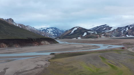 Drone-view-of-Thorsmork-mountains-and-river,-highlands-of-Iceland.-Stunning-birds-eye-view-of-icelandic-countryside-with-Krosssa-river-and-green-mossy-canyon-and-valley