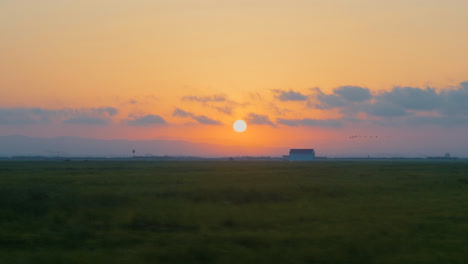 sunset in the rice paddies of albufera, valencia, spain.