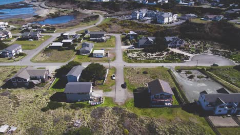 Serene-4k-rising-aerial-tilt-down-over-coastal-suburb-and-quiet-neighborhood-intersection