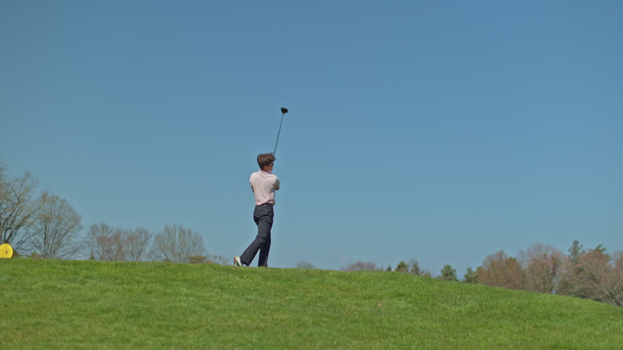 Young golfer playing on a sunny spring day in Switzerland, showcasing precise chipping, putting, bunker, and approach shots. Perfect for sports, lifestyle, and outdoor themes.