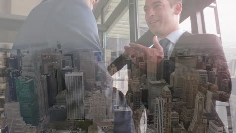 digital composition of two caucasian businessmen shaking hands against aerial view of cityscape