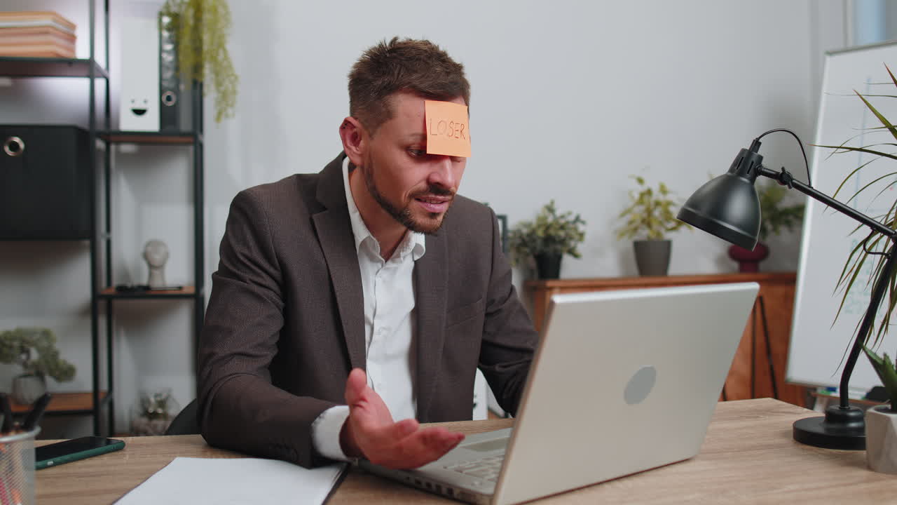 Business man working on laptop loses becoming surprised sudden lottery results bad news fortune loss