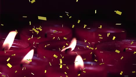 animación de confeti de oro cayendo sobre velas rojas encendidas
