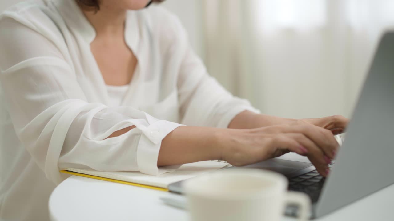 Business woman working on her Laptop from home