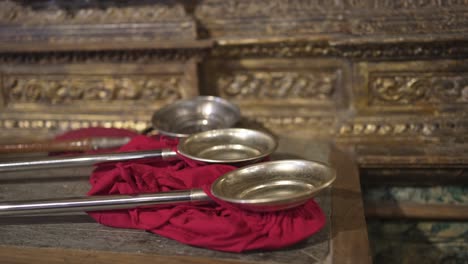 antique metal bowls used in a religious ceremony