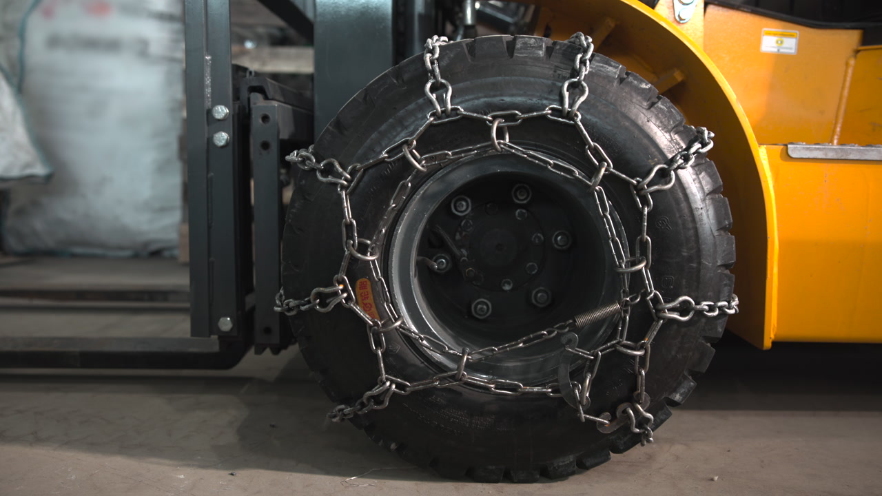 Detailed Tire Chain Pattern On Forklift Fleet Manager Conducting Preshift Traction Check Inside Cold Storage . Media