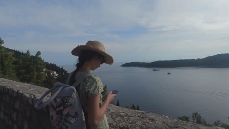 beautiful female model looking towards the sea in dubrovnik