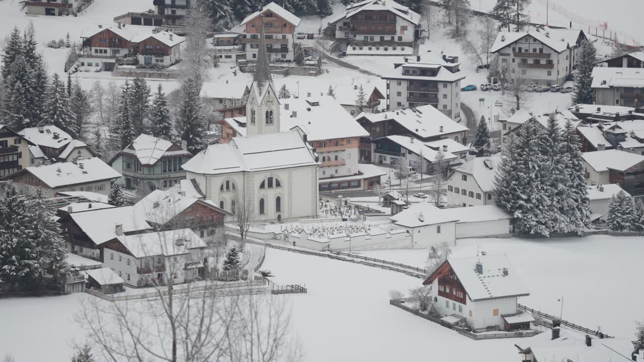 A charming Alpine village blanketed in snow in the Dolomites.