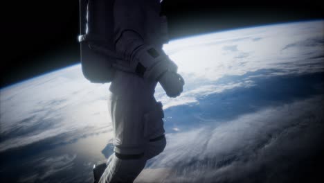 astronauta en el espacio exterior contra el telón de fondo del planeta tierra