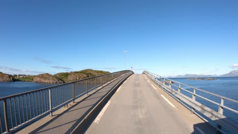 driving a car on a road in norway lofoten reine