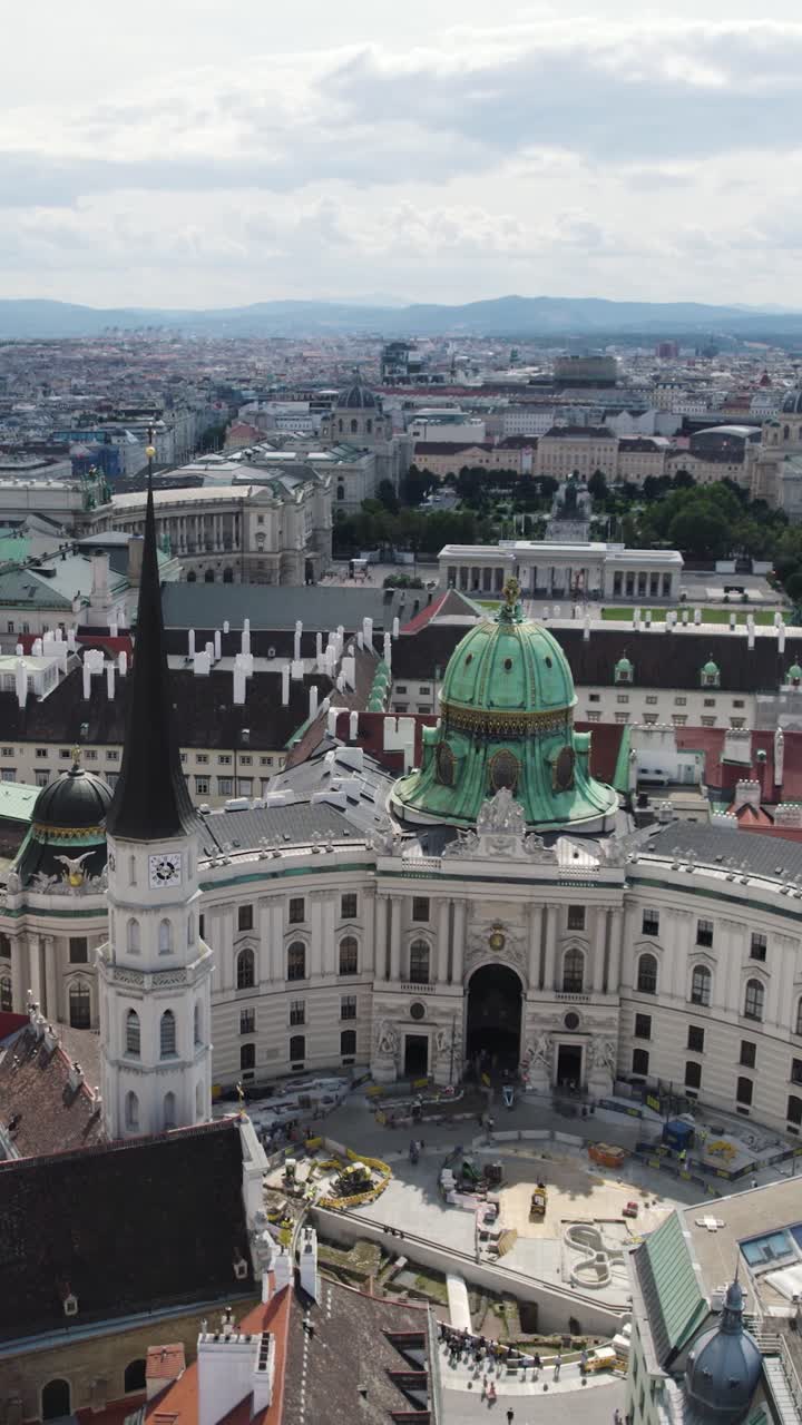 Aerial View Overlooking Hofburg Palace and Michaelerplatz In Vienna. Vertical Video, Orbit Motion