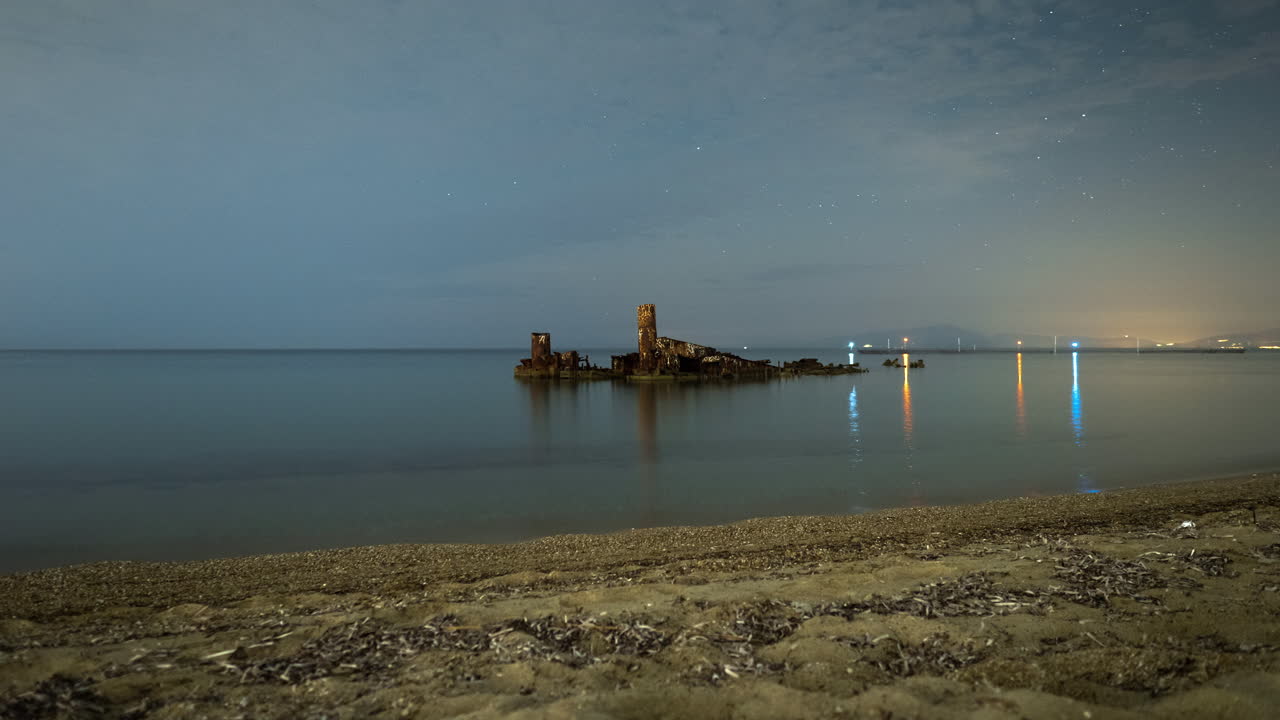 Beautiful Night Timelapse shipwreck seaside beach sand stars background Summer Greece