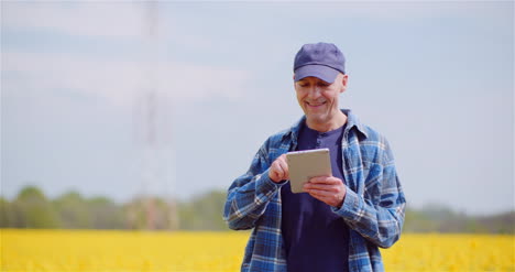 love of agriculture modern farmer using digital tablet at farm 1