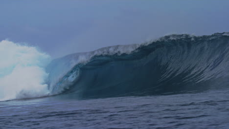 Empty-strong-ocean-wave-crashes-into-beautiful-powerful-barrel-in-slow-motion-erupting-with-whitewash