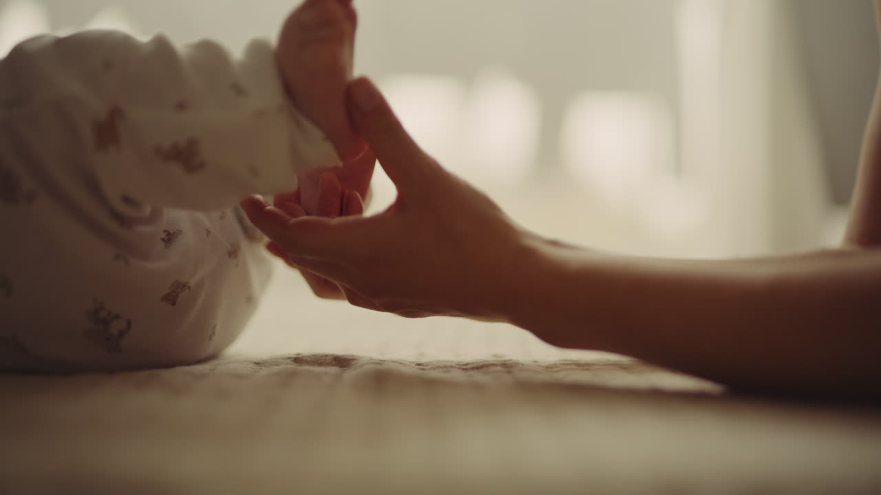 Mother Touching Newborn's Feet Symbolizing New Life