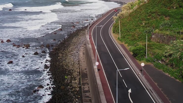 Stunning aerial view of Madeira's rugged coast and winding road