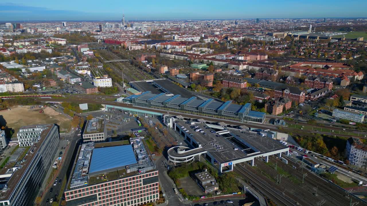 Berlin Tempelhof urban cityscape showing modern train station South Cross, railway tracks. speed ramp hyper motion time lapse Amazing aerial view flight wide orbit overview drone
