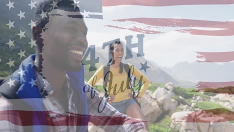 animation of independence day text over smiling diverse couple hiking