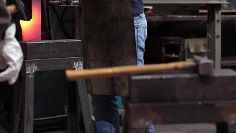 Metal-tools-on-anvil-in-blacksmith-workshop