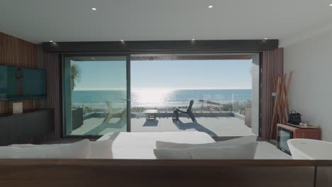 dolly right showing the stunning views from the master bedroom in a seafront villa