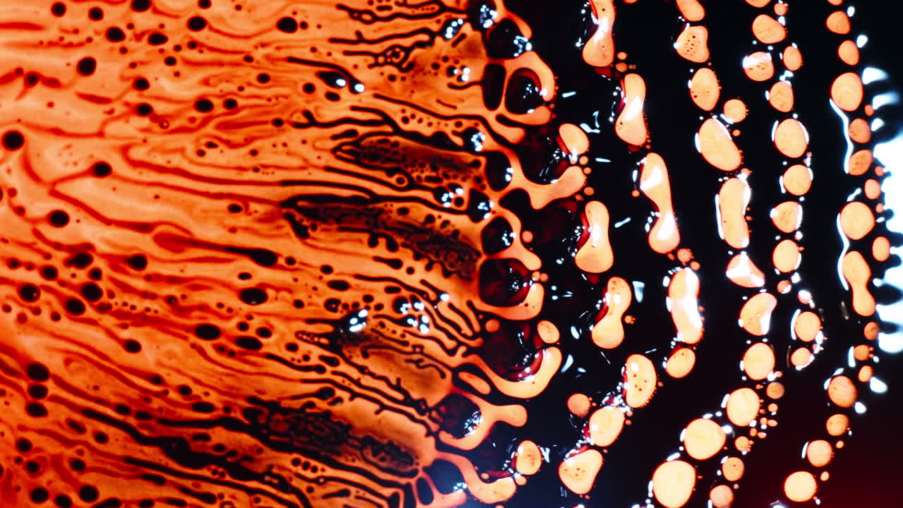 Macro of liquid dissolving with complex patterns and colors