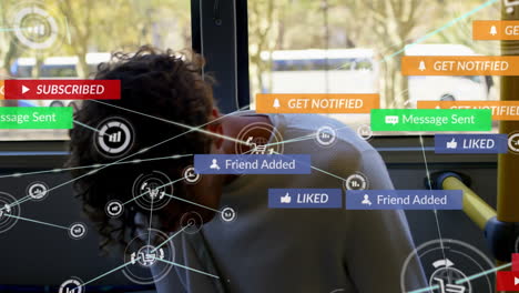 animation of network of digital and social media icons over biracial man using smartphone in the bus