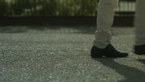 person walking on a paved ground