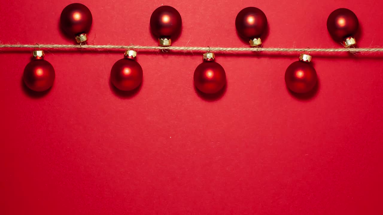 Red balls on red stop motion christmas concept