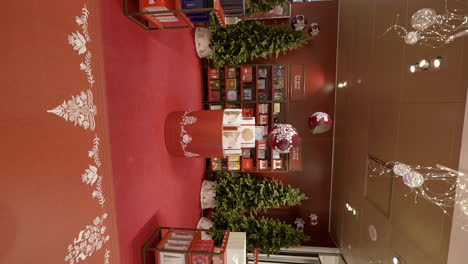 vertical shot of shopping mall decorated with christmas decorations, dolly in