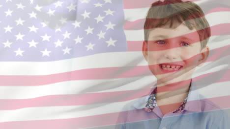 animation of american flag blowing over happy caucasian schoolboy smiling in classroom