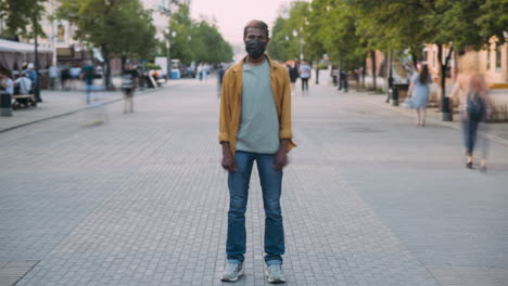 man wearing mask on city street