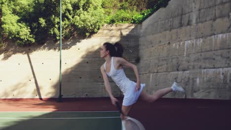 woman playing tennis on a sunny day