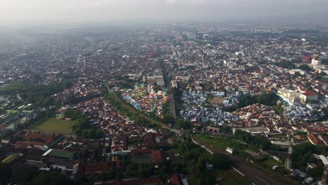 bird's eye view video capturing the demographic landscape of an overpopulated urban area in malang, east java, indonesia