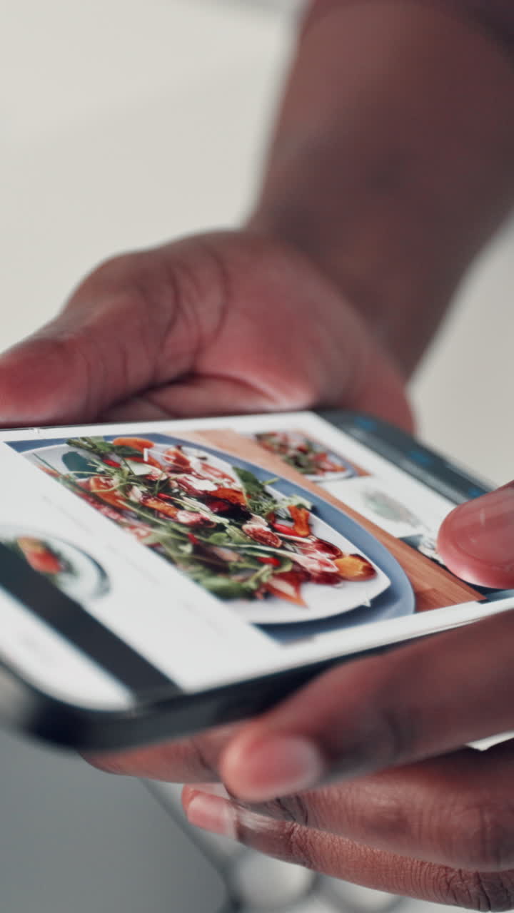 Close Up of Hands Scrolling Through Food Images on a Smartphone