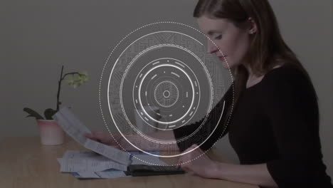 reading documents at desk, woman with circular data processing animation over