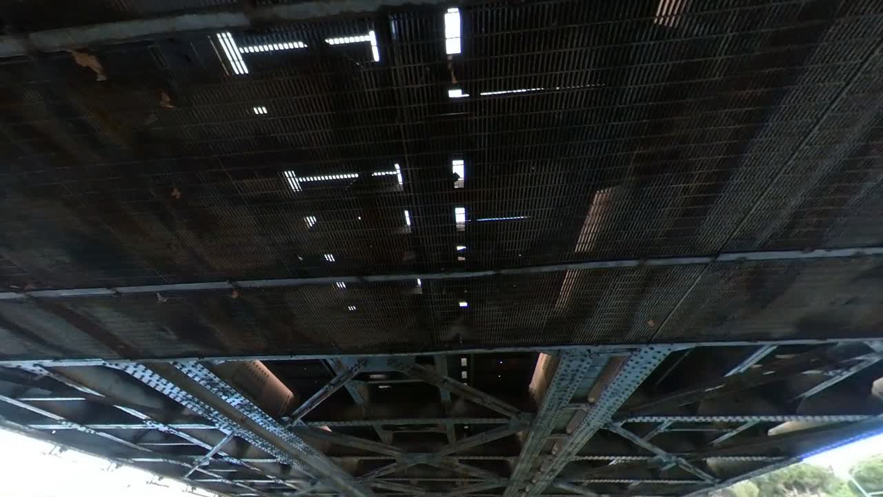 Underside View of a Metal Bridge Structure