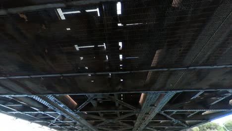 underside view of a metal bridge structure