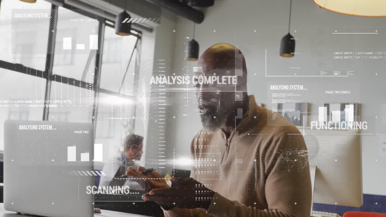 Animation of graphs, texts, computer language over african american man working on laptop in office