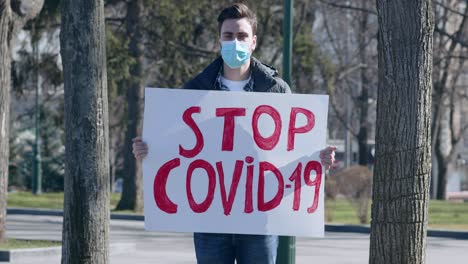 man protesting against covid-19