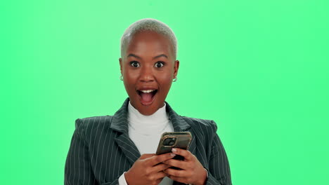 excited businesswoman celebrating success with mobile phone