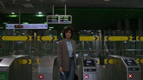 woman walking through a train station