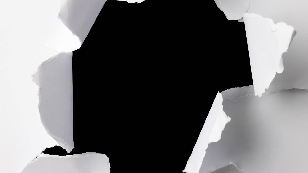 Animation of black and white teared paper over black background