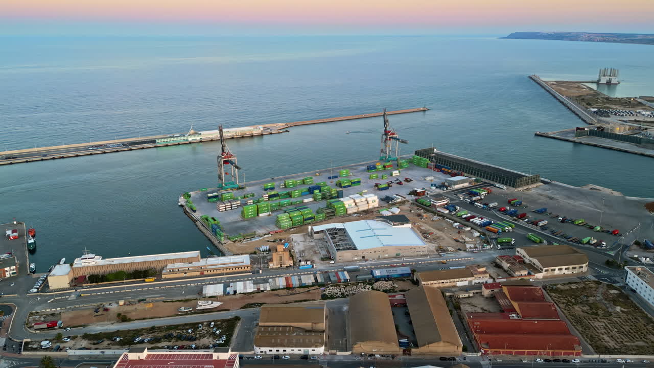 Aerial drone view of a Cargo terminal in Alicante, Spain at sunset