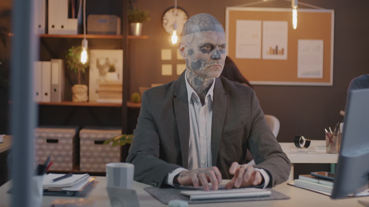 Man with Skull Makeup Working in Office