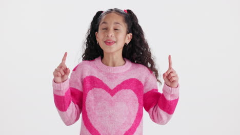 a happy girl pointing upwards