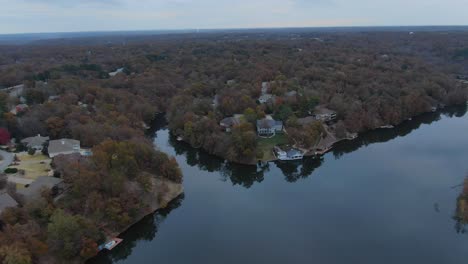 high altitude aerial view of lake shore homes