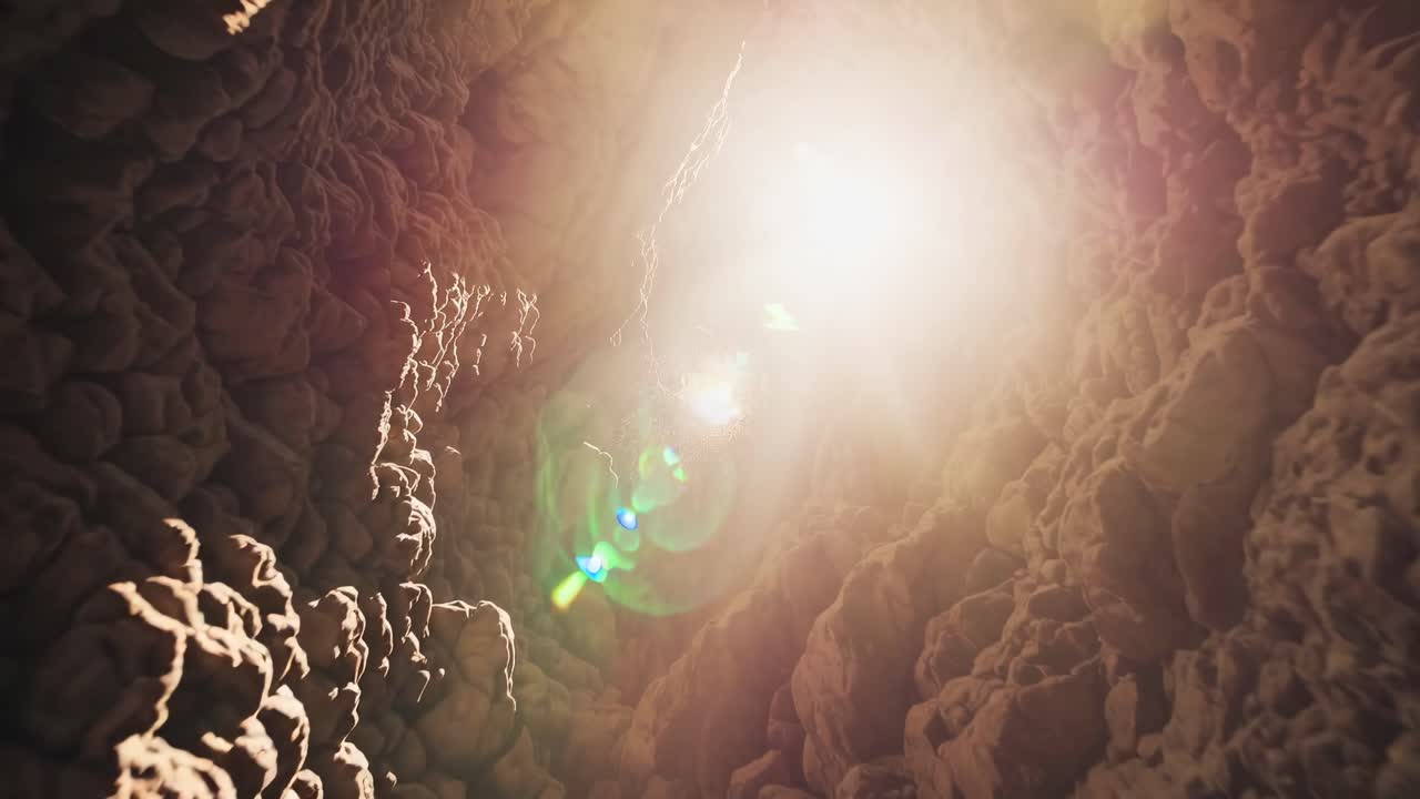 Sunlight streams into a rocky cave from above, captured in a low-angle shot, creating a dramatic
