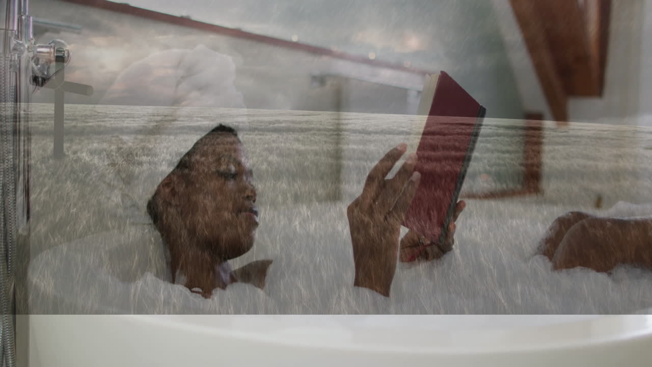 Person relaxing in bathtub reading book over serene ocean waves animation