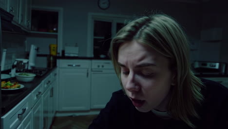 woman searching for food in the kitchen at night
