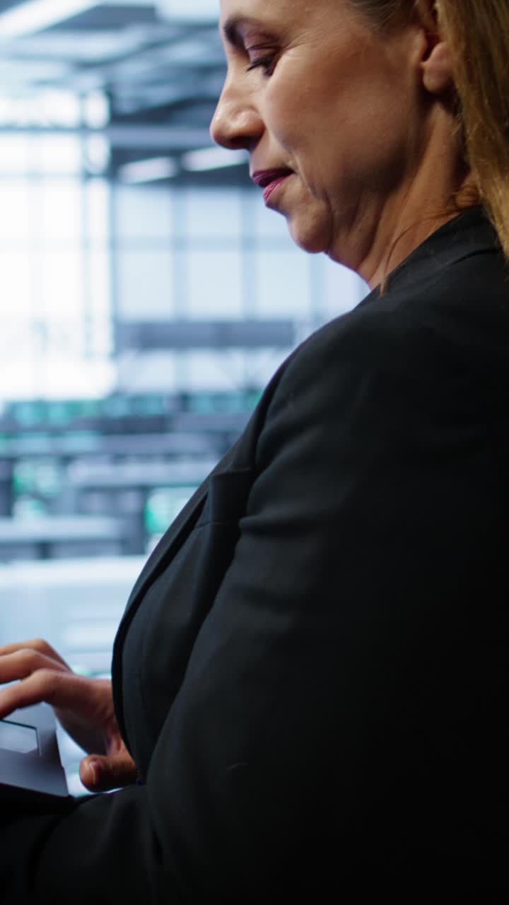 Professional Woman Typing on Laptop in Modern Office